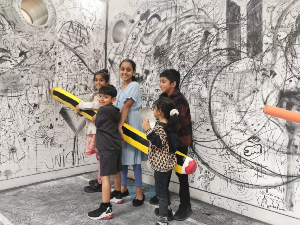Kids with big pencil at Mega Drawing Box