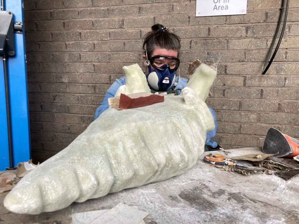 Leonie Briggs sculpting a Rombald's Rocks sculpture