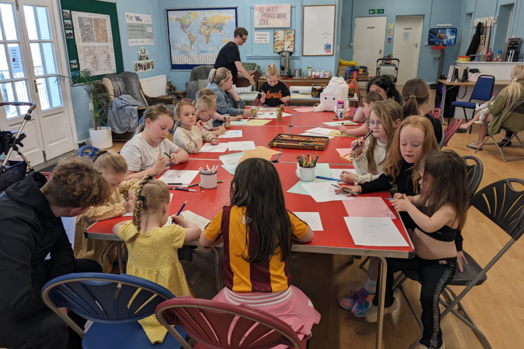 Children at Hainworth Wood decorating their Rombald's Rock sculpture